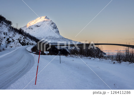 Winter road, bridge and a mountain, Norway Winter road, bridge and a mountain, Norway 126411286