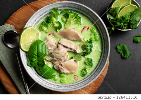 Bowl of thai green curry chicken soup 126411310