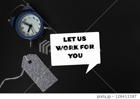 Blue alarm clock sits on a black background Blue alarm clock sits on a black background 126411397