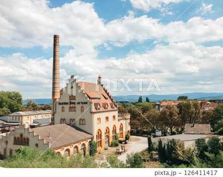 A large building with a tower and a sign that says Biergarten A large building with a tower and a sign that says Biergarten 126411417