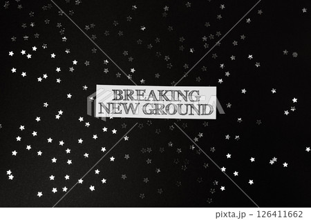 Black background with a white text that says Breaking New Ground 126411662