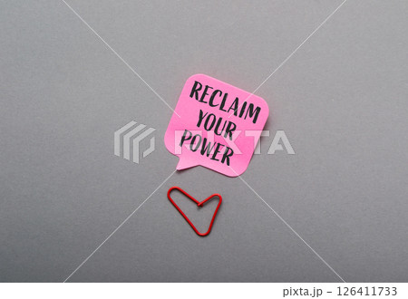 Pink sticky note with the words Reclaim Your Power written on it Pink sticky note with the words Reclaim Your Power written on it 126411733