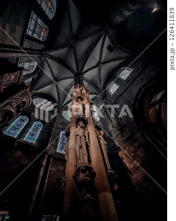 Tall pillar with a statue of a woman on top of it 126411839