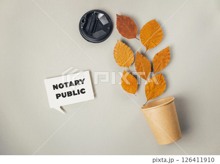 Sign that says notary public is on a grey background 126411910