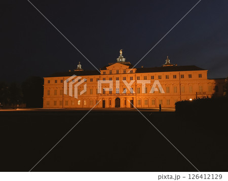 A large building with a lot of windows and a tall tower A large building with a lot of windows and a tall tower 126412129