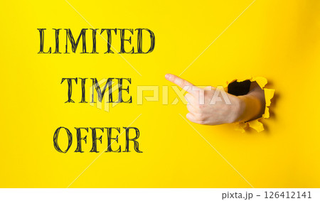 A hand pointing to a yellow background with the words limited time offer 126412141