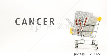 Shopping cart full of pills with the word Cancer written on it Shopping cart full of pills with the word Cancer written on it 126412299
