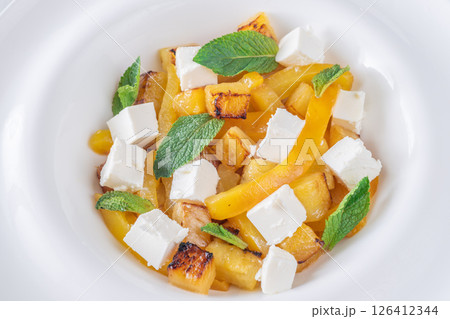 Colorful Salad With Feta, Grilled Peppers, Pineapple And Fresh Mint Leaves 126412344