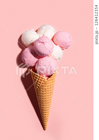 Many Ice cream scoops in waffle cone Many Ice cream scoops in waffle cone 126412354