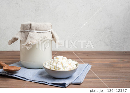 Milk kefir grains and jar of kefir 126412387