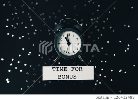 Black and white photo of a clock with the words Time for Bonus written below Black and white photo of a clock with the words Time for Bonus written below 126412485