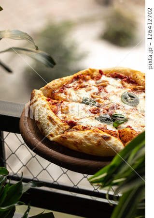 Portion of baked italian pizza margherita Portion of baked italian pizza margherita 126412702