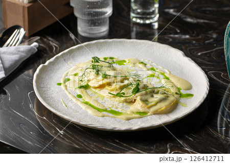 Portion of italian ravioli dumplings dish 126412711