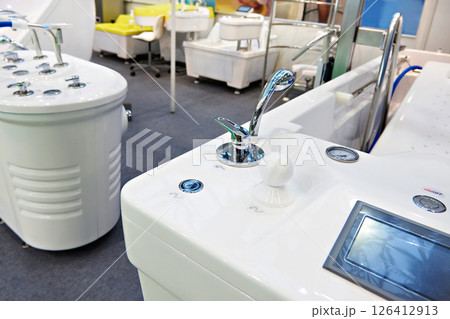Modern bathtubs and jacuzzi in store Modern bathtubs and jacuzzi in store 126412913