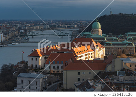 Golden light illuminating the Buda castle and the liberty bridge at sunset in Budapest Golden light illuminating the Buda castle and the liberty bridge at sunset in Budapest 126413120