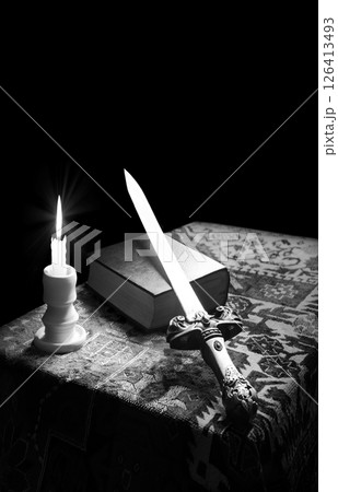 Iron sword on old bible 126413493