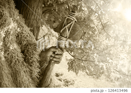 Old hand with stone axe Old hand with stone axe 126413496