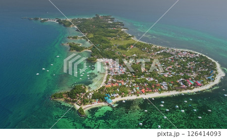 Aerial drone footage revealing the stunning beauty of Malapascua Island in the Philippines, featuring vibrant coral reefs, turquoise waters, and white sandy beaches Aerial drone footage revealing the stunning beauty of Malapascua Island in the Philippines, featuring vibrant coral reefs, turquoise waters, and white sandy beaches 126414093