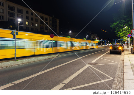 Scenic Dresden cityscape yellow tram crossing Carola bridge Elbe river Saxony State Chancellery Government Office background. Travel city tour trip Germany Saxony capital city sightseeing landmark 126414656