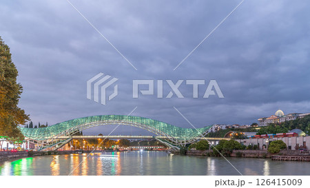 Bridge of Peace day to night timelapse, a bow-shaped pedestrian bridge in Tbilisi, Georgia 126415009