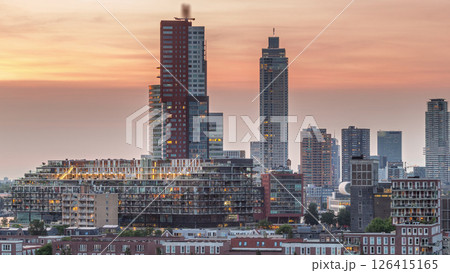 Aerial day to night timelapse of Katendrecht peninsula and Maashaven harbour in Rotterdam, The Netherlands. 126415165