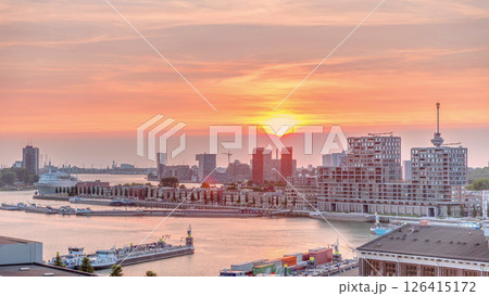 Aerial timelapse panorama of Katendrecht peninsula and Maashaven harbour at sunset in Rotterdam, The Netherlands. 126415172