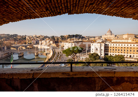 Morning View of St. Peters Basilica Framed by Castle Walls 126415474