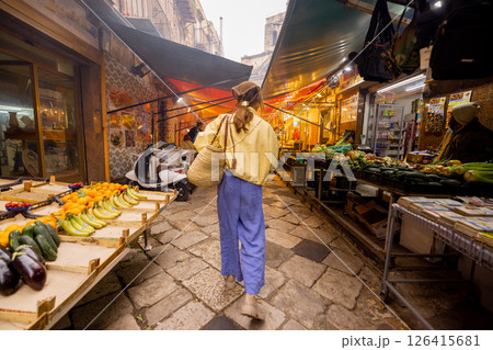 Choosing greens at Sicilian street market Choosing greens at Sicilian street market 126415681