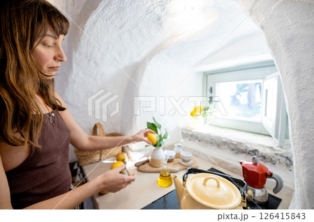 Morning ritual in a trullo kitchen 126415843