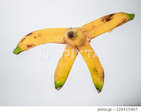 Yellow banana peel on white background Yellow banana peel on white background 126415907