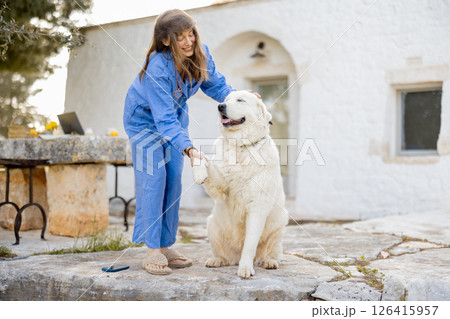 Joyful connection with a fluffy friend Joyful connection with a fluffy friend 126415957