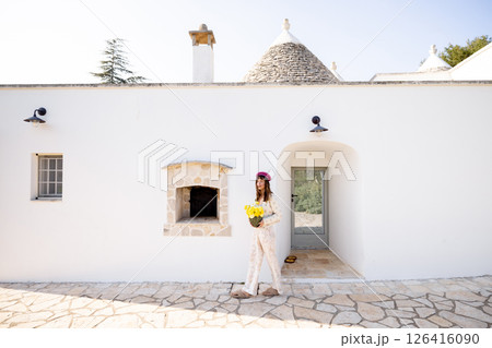 Trullo entrance with flowers 126416090