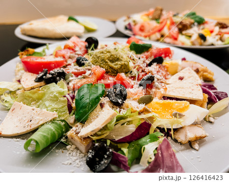 Clean eating concept - vibrant plate with no sugar, low fat, and rich in nutrients. Fresh, organic ingredients combined into a balanced and delicious healthy meal. healthy salad with vegetables Clean eating concept - vibrant plate with no sugar, low fat, and rich in nutrients. Fresh, organic ingredients combined into a balanced and delicious healthy meal. healthy salad with vegetables 126416423