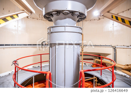 Inside the Orlik Hydroelectric Power Station in Czechia, a large Kaplan turbine is prominently displayed. The structure showcases the engineering behind hydroelectric power generation. Inside the Orlik Hydroelectric Power Station in Czechia, a large Kaplan turbine is prominently displayed. The structure showcases the engineering behind hydroelectric power generation. 126416649