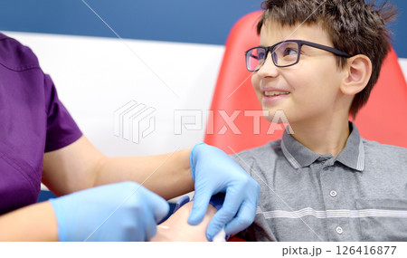 Close up view during of taking a blood sample for examination in a modern laboratory Close up view during of taking a blood sample for examination in a modern laboratory 126416877