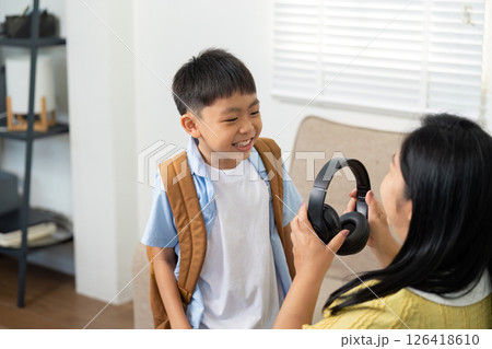 Back to School: Joyful Moment Between Child and Parent Preparing for School 126418610