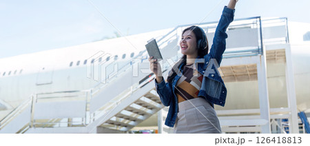 Journey excitement at the airport with traveler celebrating Journey excitement at the airport with traveler celebrating 126418813
