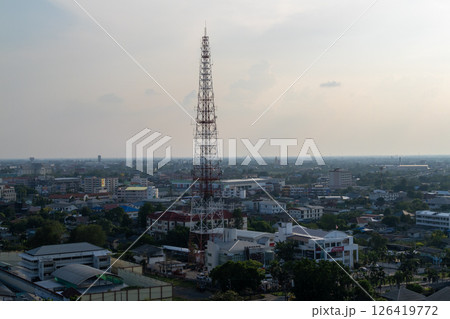 Telecommunication tower overlooking urban landscape city skyline aerial view technology concept Telecommunication tower overlooking urban landscape city skyline aerial view technology concept 126419772
