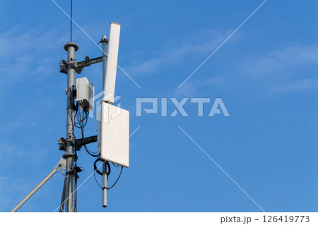 Telecommunication towers a close-up look at urban technology and connectivity in clear skies Telecommunication towers a close-up look at urban technology and connectivity in clear skies 126419773