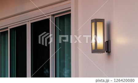 Modern outdoor lighting fixture by sliding glass doors home decor elegant environment daytime view 126420080