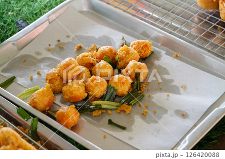 Fried snack delights local market food outdoor setting close-up view culinary adventure 126420088