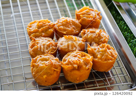 Baking savory muffins home kitchen food cozy environment top-down view culinary concept Baking savory muffins home kitchen food cozy environment top-down view culinary concept 126420092