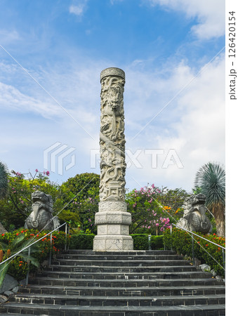 Singapore, Singapore - 4 April 2025: Granite Huabiao column with dragon carving in The Canyon, Gardens by the Bay, inspired by classical Chinese architecture Singapore, Singapore - 4 April 2025: Granite Huabiao column with dragon carving in The Canyon, Gardens by the Bay, inspired by classical Chinese architecture 126420154