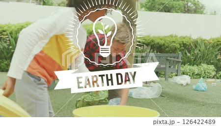 Earth Day light bulb image over people cleaning park Earth Day light bulb image over people cleaning park 126422489