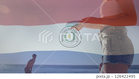 Paraguay flag image over people enjoying beach activities 126422495