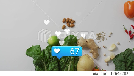 Social media likes image over fresh vegetables and nuts on white background 126422823