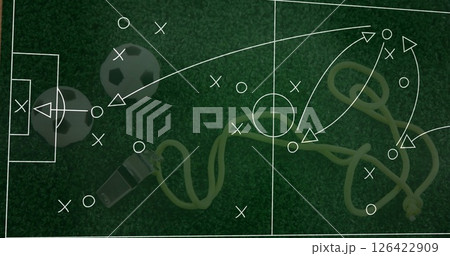 Soccer strategy image over soccer balls, whistle, and jump rope on grass Soccer strategy image over soccer balls, whistle, and jump rope on grass 126422909