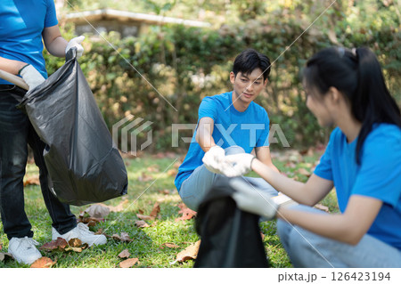 Youth Engagement and Community Service. Volunteers on the ground working diligently to clean up their local environment. 126423194