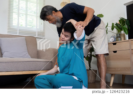 Wellness activities with father and daughter with Down syndrome 126423216