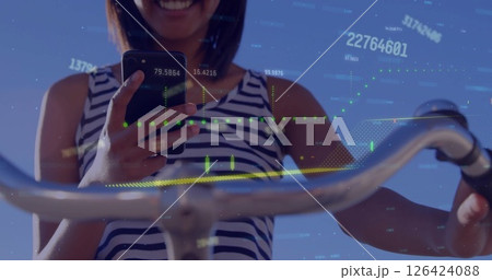 Image of graph and processing data over caucasian woman on bike using smartphone 126424088